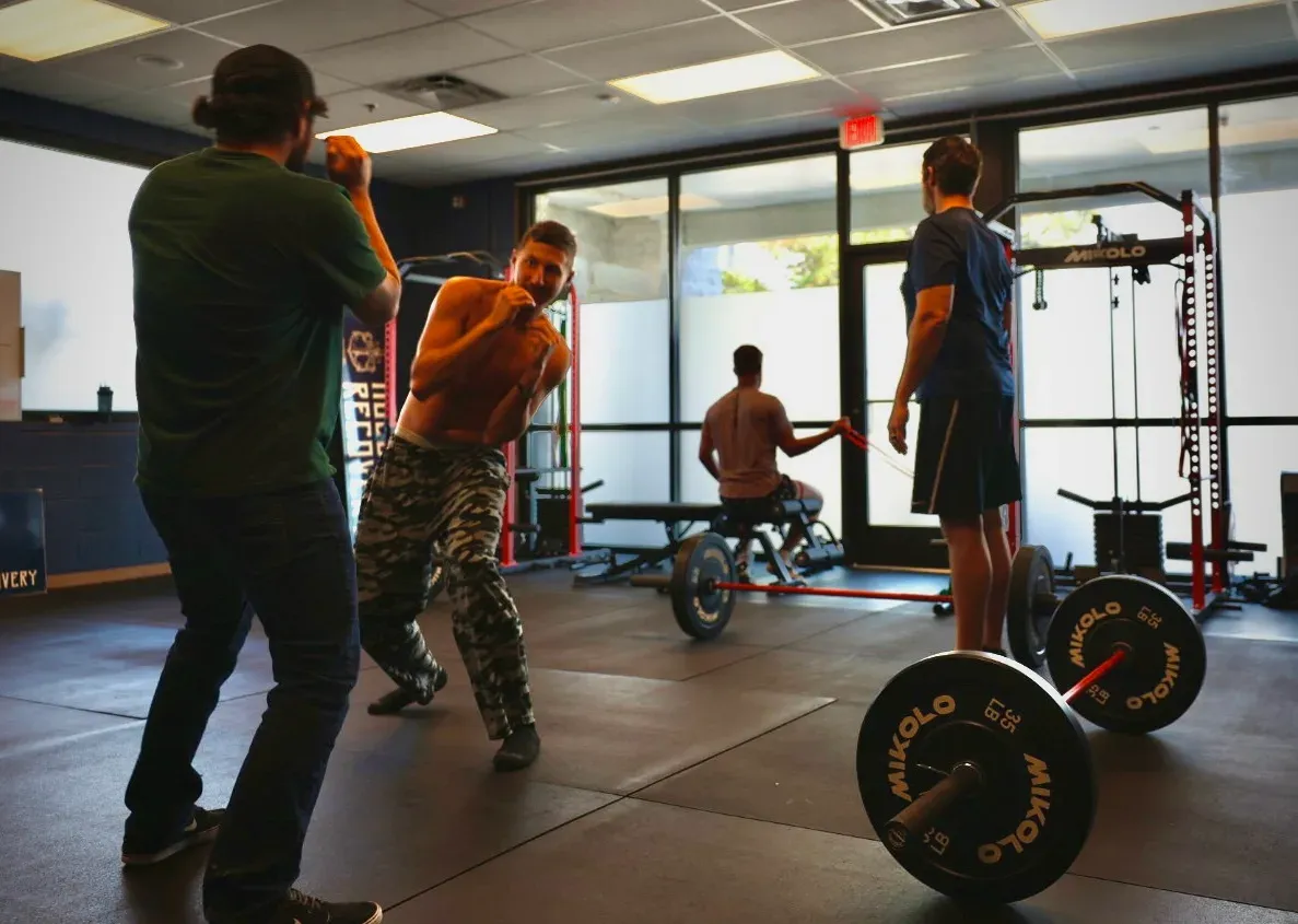 Pad work on the floor of the Resilience Lab