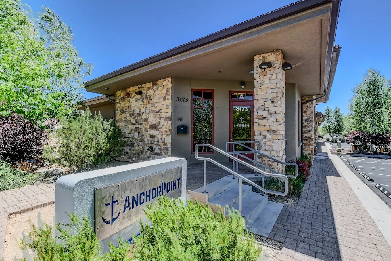 The front of the AnchorPoint house, with its sign