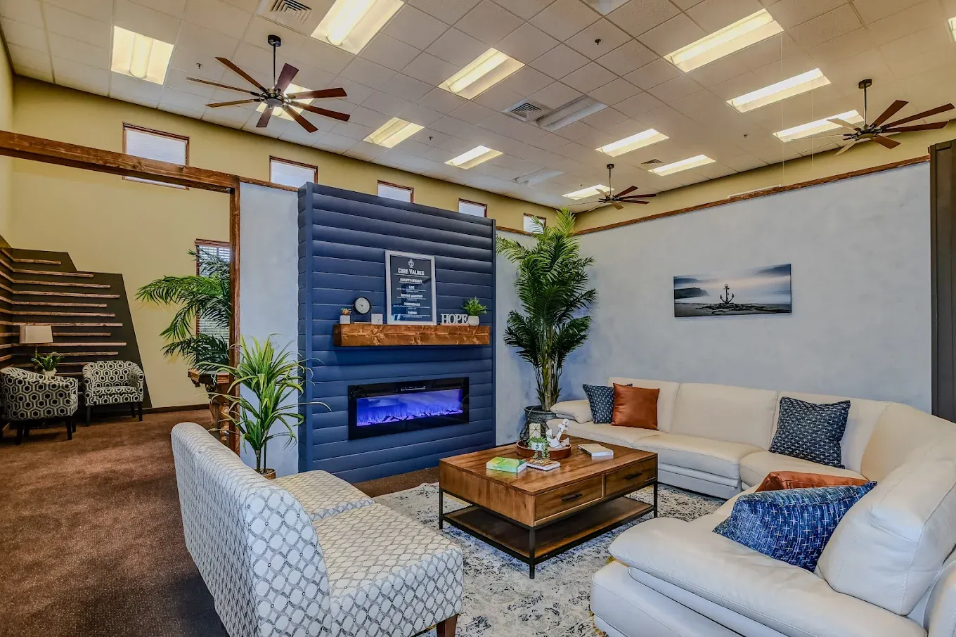 The AnchorPoint living room with sofas and a fireplace