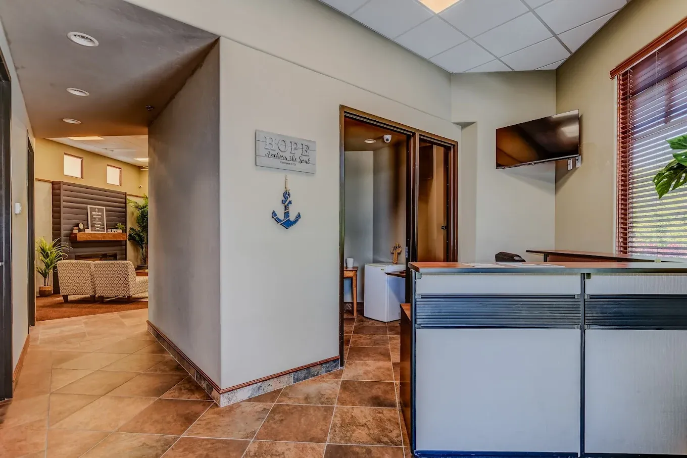 The reception hallway at AnchorPoint, with an anchor sign on the wall